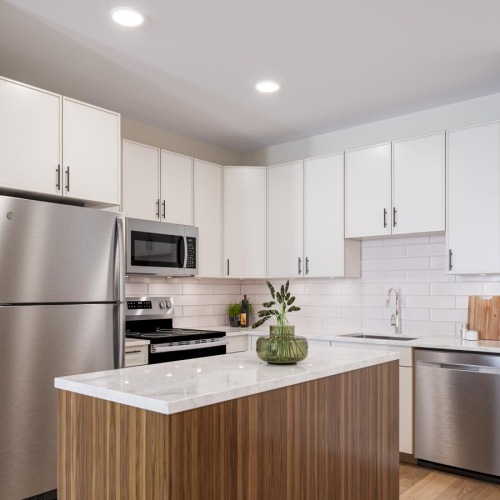 a kitchen with white cabinets
