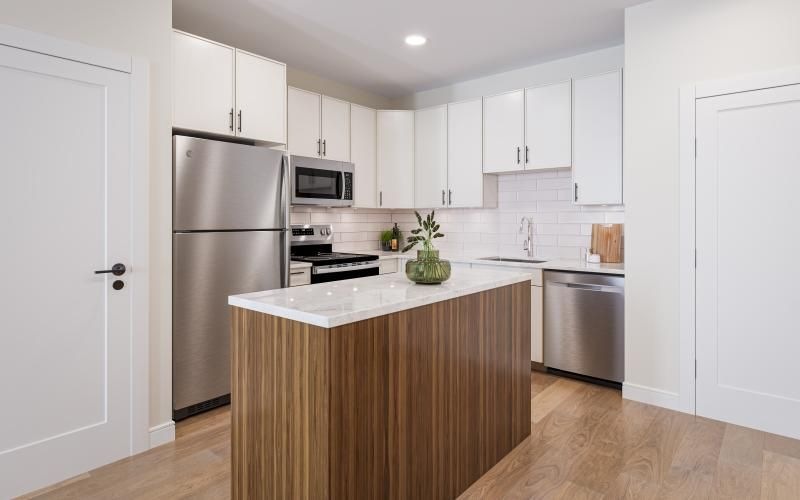 a kitchen with white cabinets