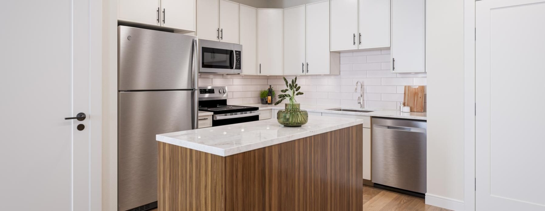 a kitchen with white cabinets